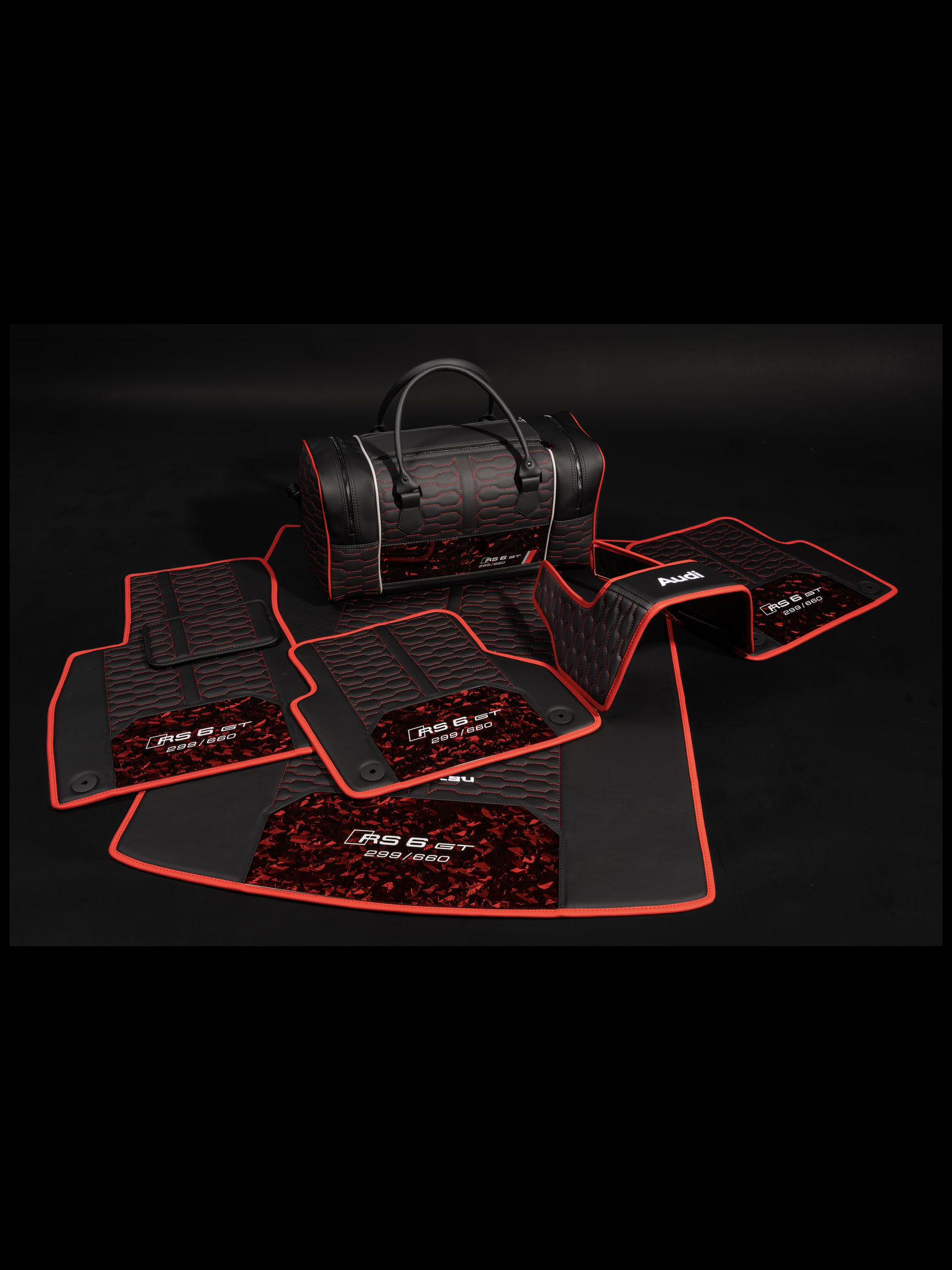 Audi RS6 GT floor mats with a matching weekender bag